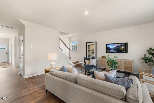 living room featuring dark hardwood / wood-style floors