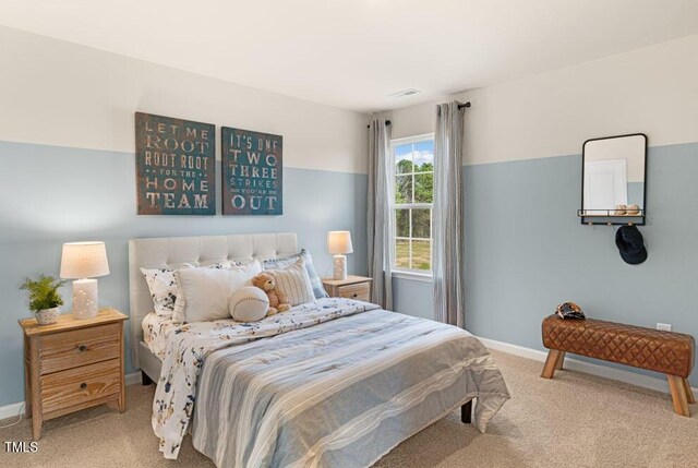 bedroom featuring light carpet