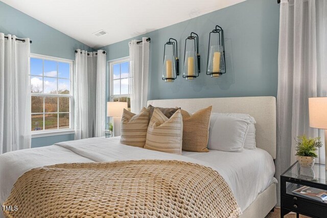 bedroom with lofted ceiling