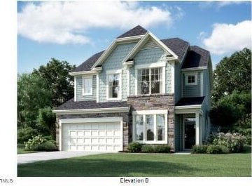 view of front of home featuring an attached garage, concrete driveway, and a front lawn