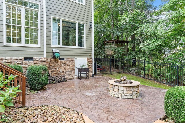 view of patio / terrace with a fire pit