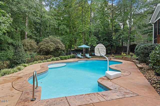 view of swimming pool featuring a patio