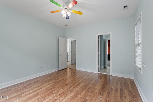 unfurnished bedroom featuring ceiling fan and hardwood / wood-style flooring