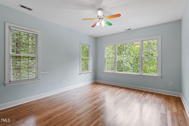 spare room with light hardwood / wood-style flooring and ceiling fan