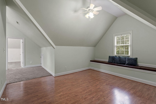 additional living space with ceiling fan, hardwood / wood-style floors, and vaulted ceiling