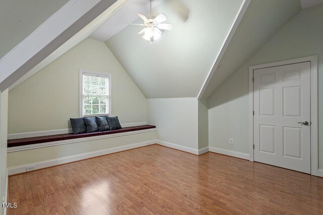 bonus room with ceiling fan, lofted ceiling, and hardwood / wood-style floors