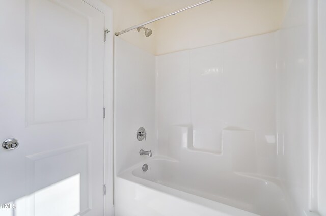 bathroom featuring  shower combination