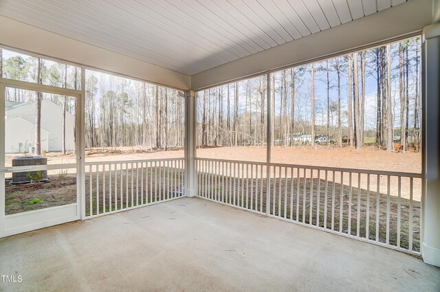 unfurnished sunroom with a wealth of natural light