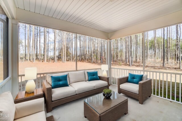 sunroom / solarium featuring wooden ceiling