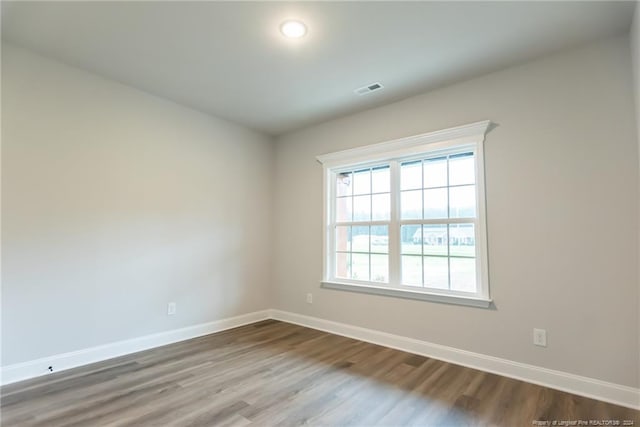 empty room featuring wood-type flooring