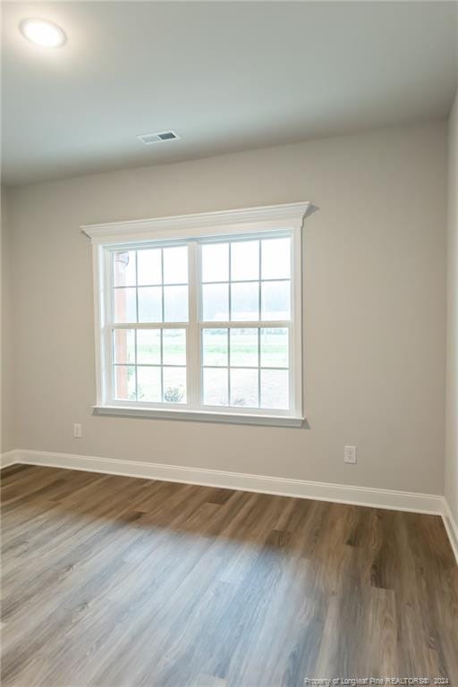 unfurnished room featuring wood-type flooring