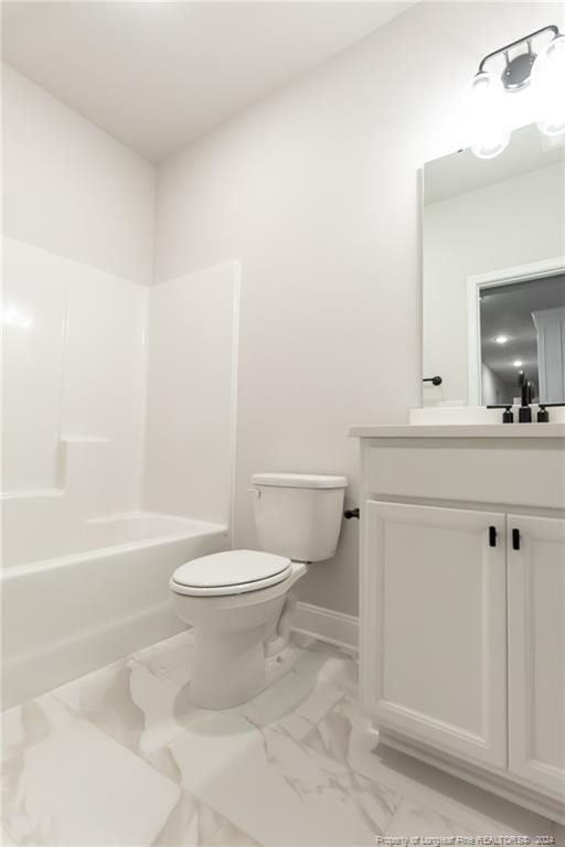 full bathroom featuring toilet, vanity, and washtub / shower combination