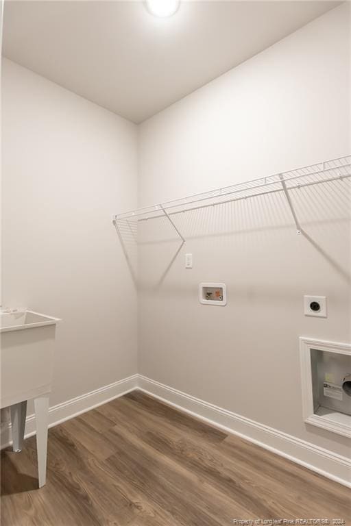 laundry room featuring washer hookup, electric dryer hookup, and dark hardwood / wood-style flooring