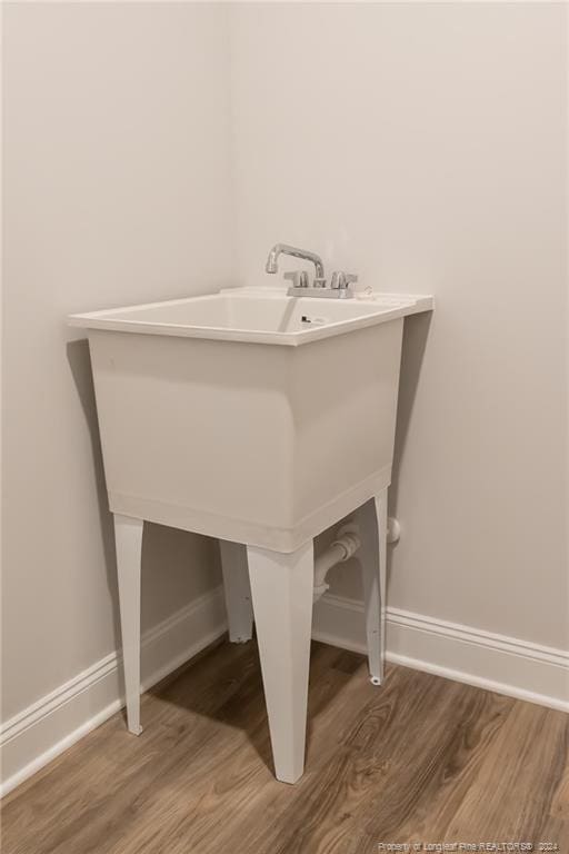 bathroom with sink and wood-type flooring