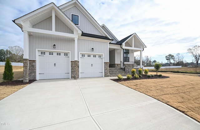 craftsman house with a porch and a garage