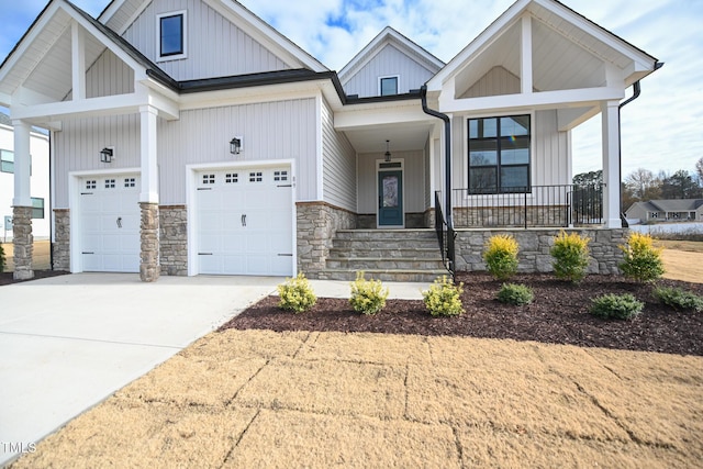 view of front of property with a garage and covered porch