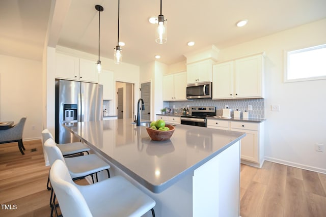 kitchen featuring white cabinetry and stainless steel appliances