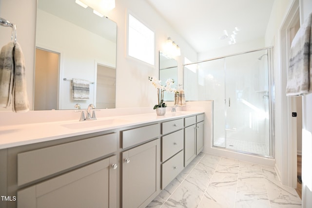 bathroom with walk in shower and vanity