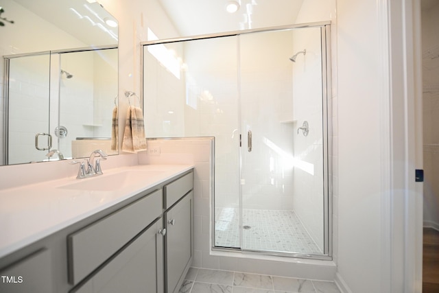 bathroom with vanity and an enclosed shower