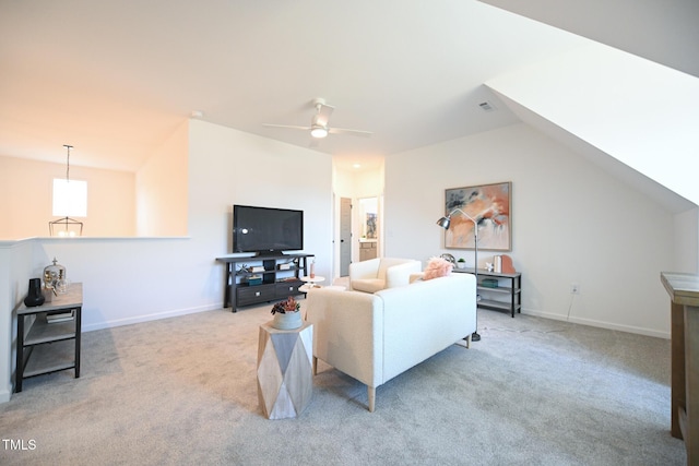 living room featuring lofted ceiling, light colored carpet, and ceiling fan