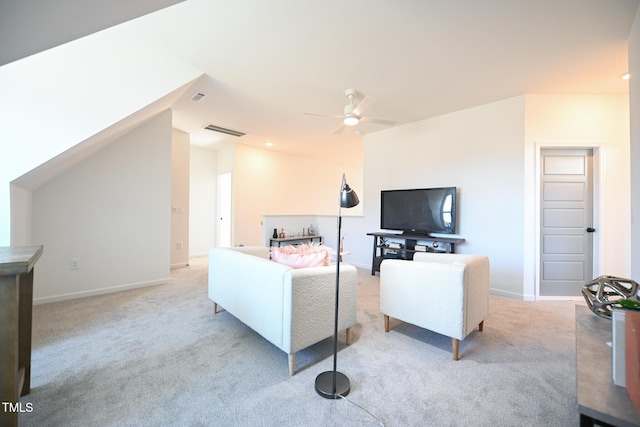 carpeted living room with ceiling fan