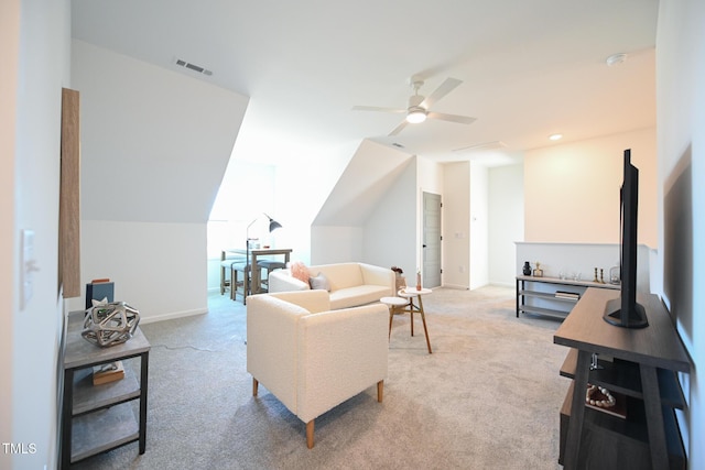 carpeted living room featuring vaulted ceiling and ceiling fan