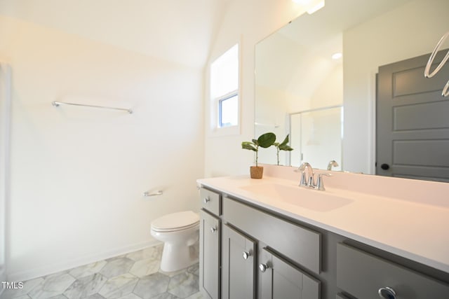 bathroom with vanity, toilet, and walk in shower