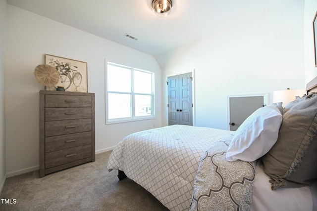 carpeted bedroom featuring vaulted ceiling