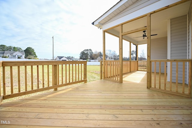 wooden terrace featuring ceiling fan