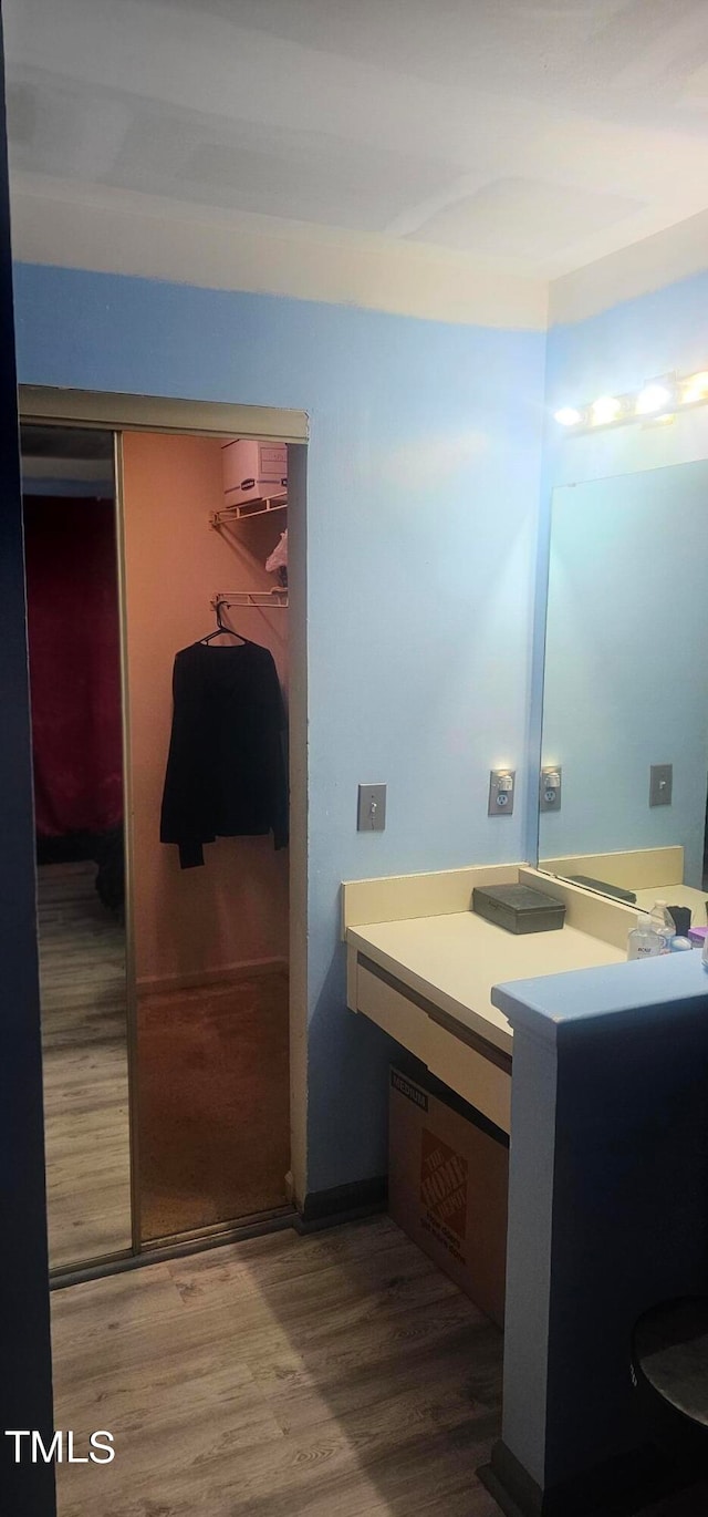 bathroom with vanity and hardwood / wood-style floors