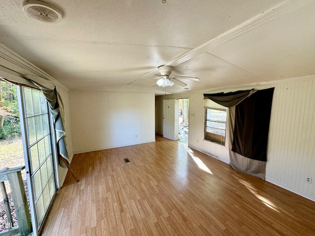 interior space with vaulted ceiling, light hardwood / wood-style flooring, a healthy amount of sunlight, and ceiling fan