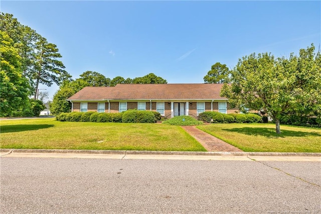 ranch-style home featuring a front yard