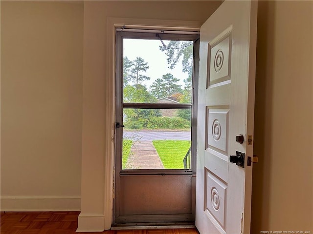 foyer entrance featuring plenty of natural light and parquet flooring