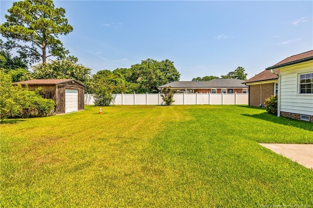 view of yard with an outdoor structure and a garage