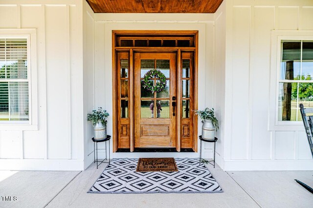 doorway to property with board and batten siding