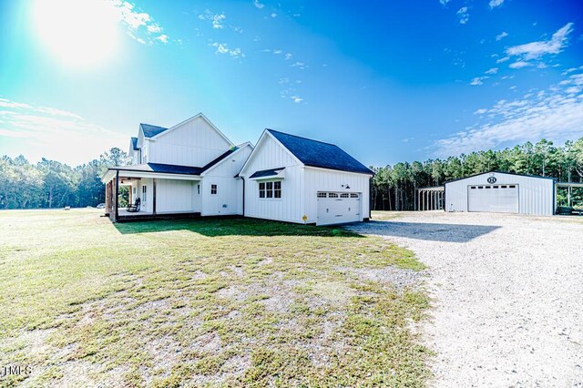 view of property exterior featuring a lawn, driveway, and a garage