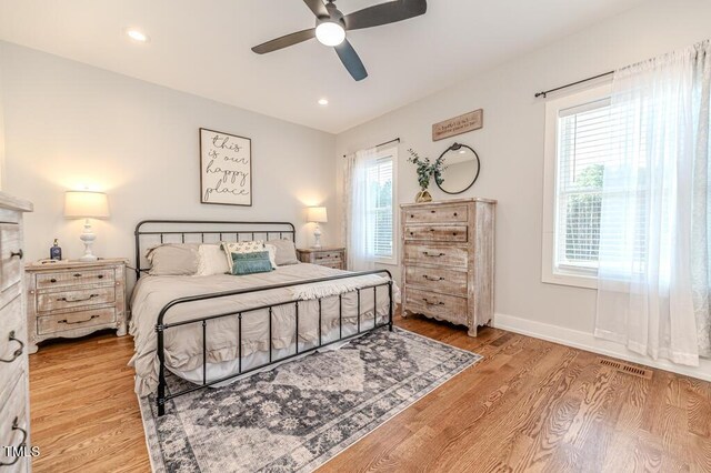 bedroom featuring baseboards, visible vents, recessed lighting, and light wood-type flooring
