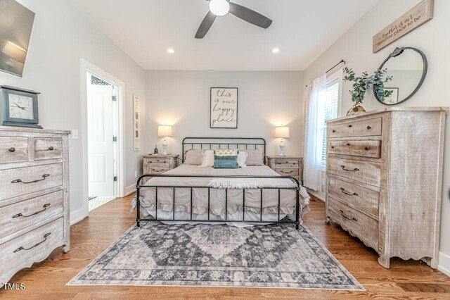 bedroom featuring baseboards, recessed lighting, and light wood finished floors