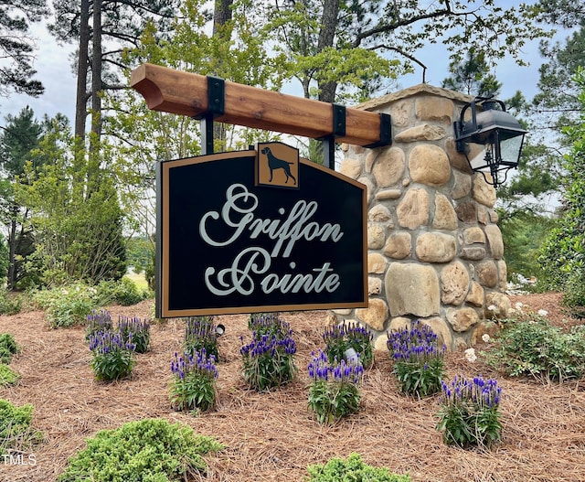 community / neighborhood sign with a carport