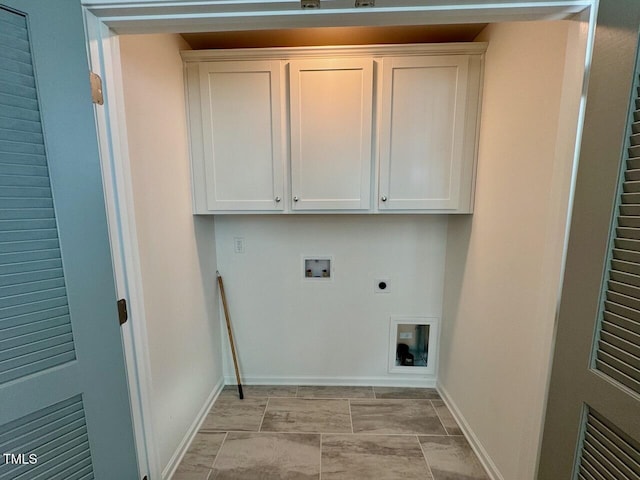 washroom featuring baseboards, washer hookup, cabinet space, and hookup for an electric dryer