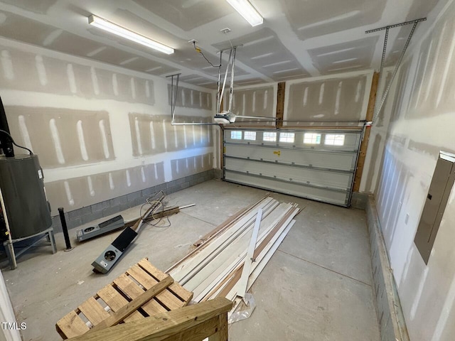 garage with water heater and a garage door opener