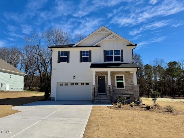 craftsman inspired home with driveway, a porch, board and batten siding, and an attached garage