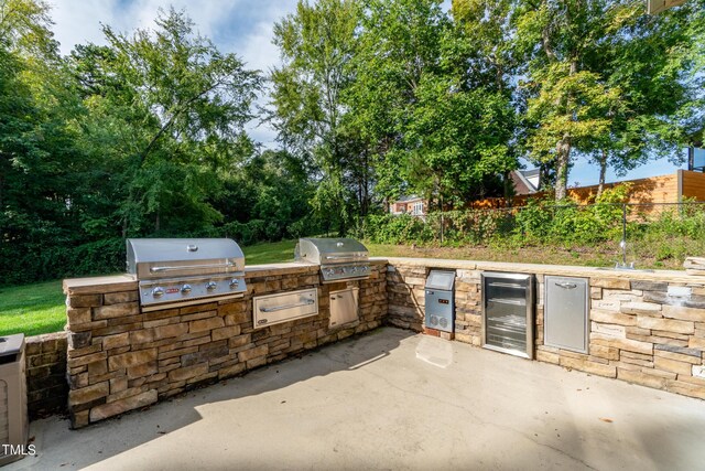 view of patio / terrace with area for grilling and a grill