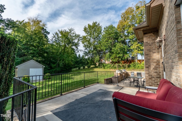 view of patio featuring a shed and an outdoor hangout area