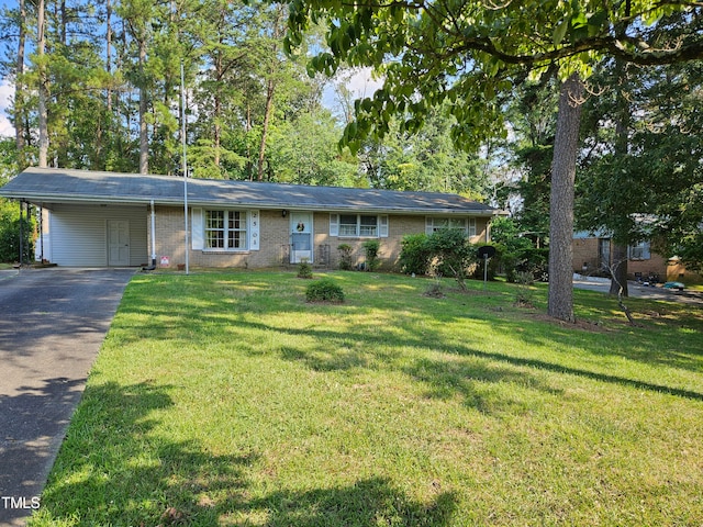 ranch-style house with a carport and a front yard