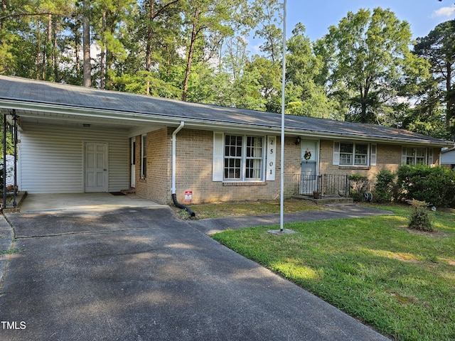 ranch-style house with a front yard and a carport