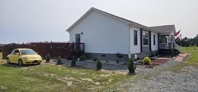 view of side of home featuring a lawn