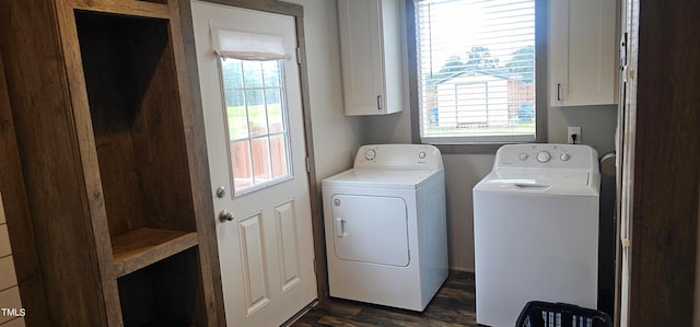 clothes washing area featuring cabinets, dark hardwood / wood-style floors, washer and clothes dryer, and a healthy amount of sunlight