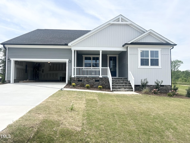 view of front of house featuring crawl space, driveway, an attached garage, a porch, and a front yard