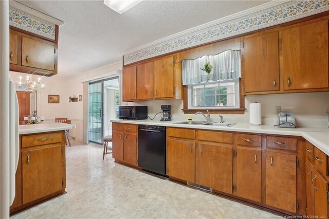 kitchen with ornamental molding, black appliances, a textured ceiling, and sink